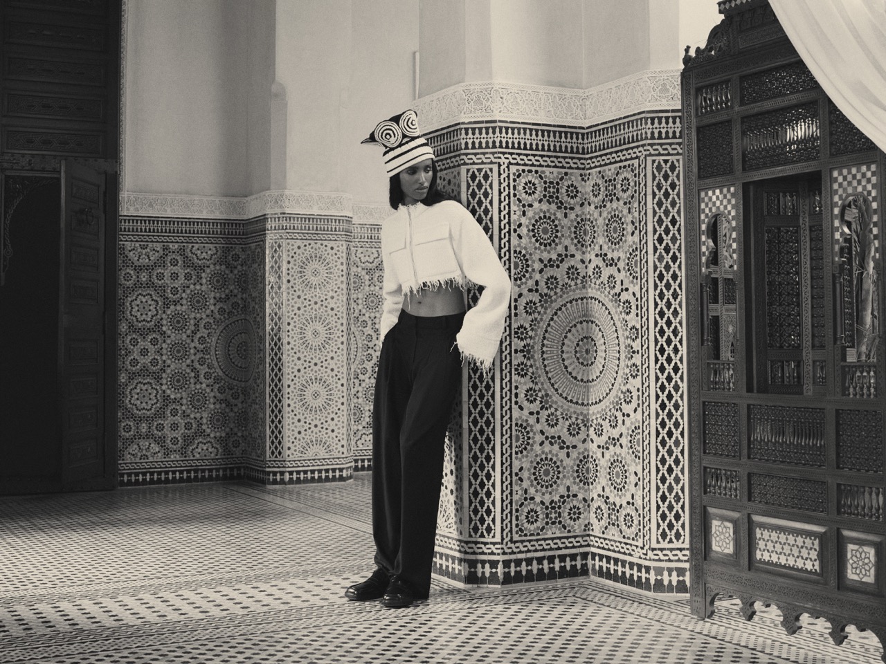 Bibi wears a Jean Paul Gaultier vintage wool embroidered beanie (stylist’s own), Jil Sander bouclé knit fringed crop jacket ($4,890), Maison Margiela wide-leg trouser ($1,165) and Flattered Ilse leather loafers ($325). Bibi Abdulkadir by Su Mustecaplioglu 3
